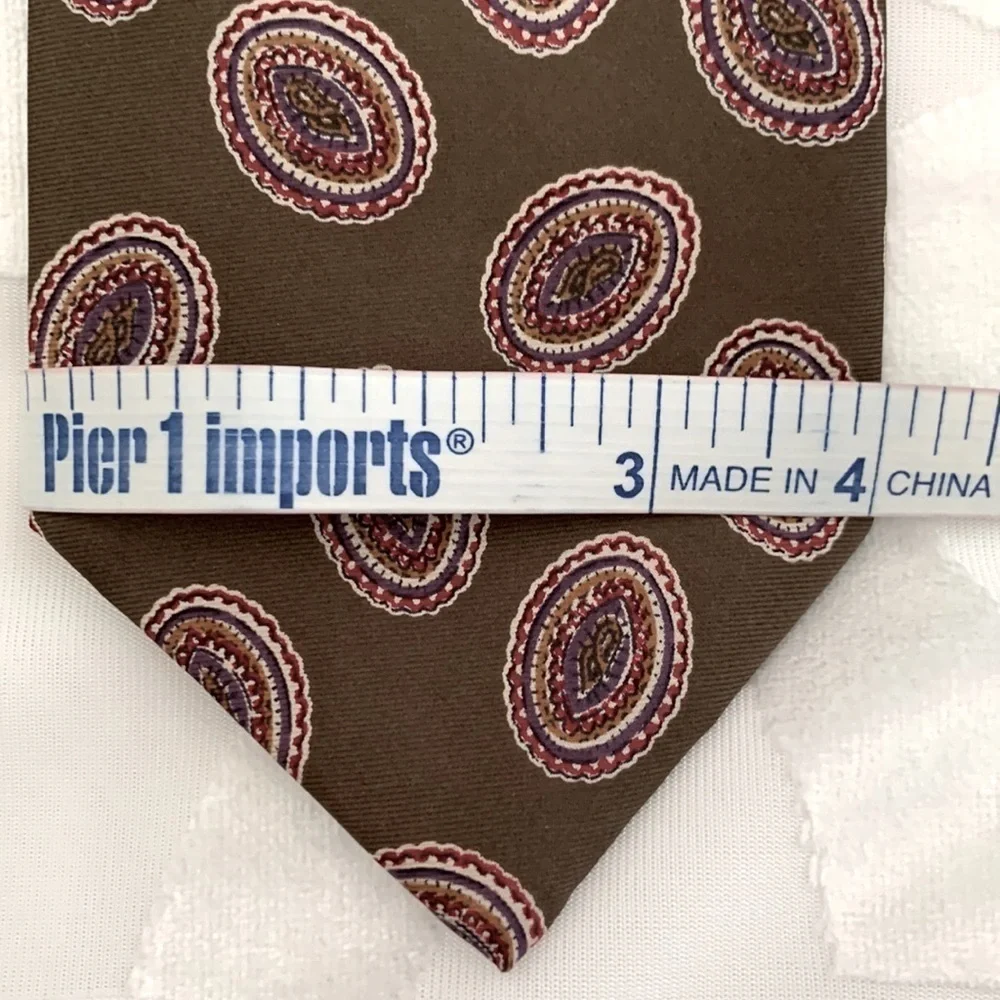 Alexander Cross Ltd Men’s Tie. 100% Silk. Base is Brown with Red & Blue Paisley